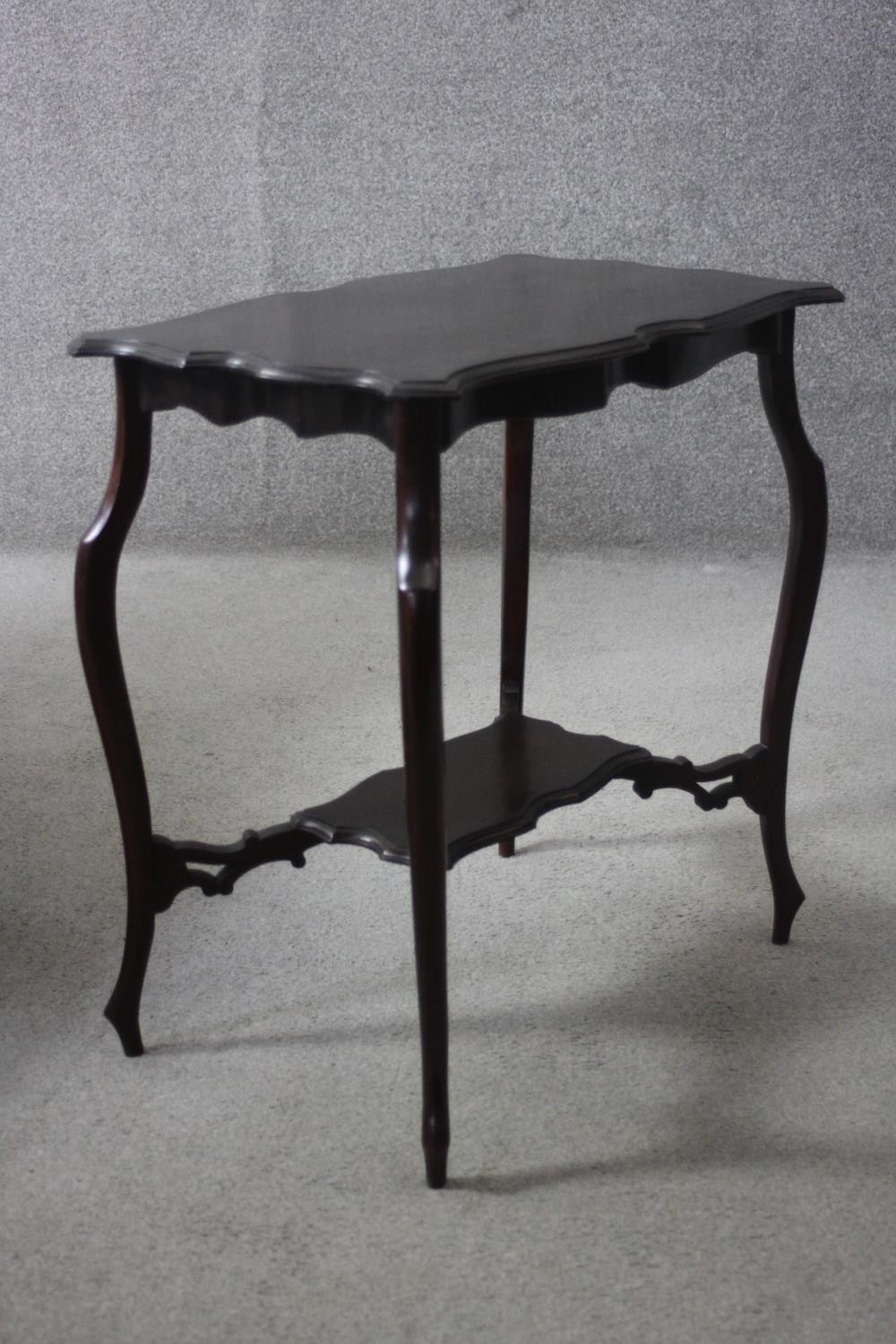 A C.1900 shaped top occasional table on cabriole supports united by under tier. H.67 W.64 D.41 cm. - Image 2 of 5