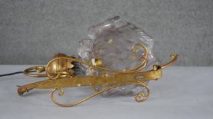 A wall mounted Murano style glass floral design light with scrolling gilt metal bracket. (damaged)