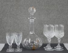 A collection of crystal. Including a set of four pressed glass wine glasses, a set of four cut