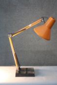 A vintage Danish orange HCF anglepoise style lamp. H.77 W.20 cm.