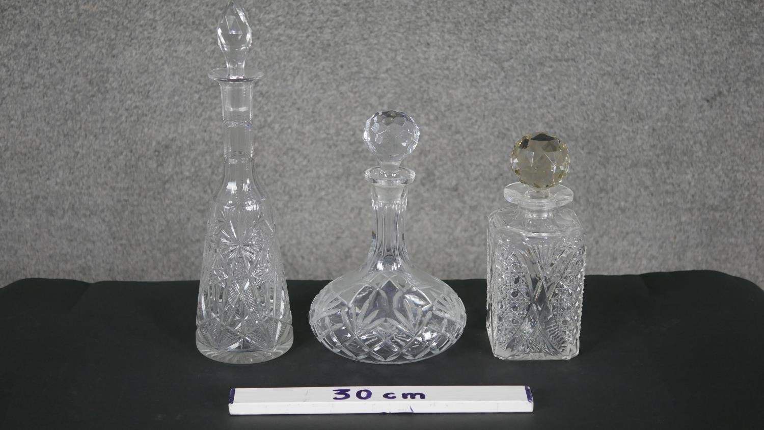 Three cut crystal decanters. One rectangular with a faceted ball stopper and the other two with - Image 6 of 6