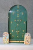 A vintage Chad Valley painted Bagatelle board with metal balls along with a Circus and Popeye