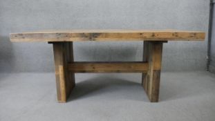 A contemporary West Elm planked hardwood dining table from reclaimed timbers. H.78 W.183 D.100