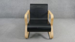 A mid century vintage Alvar Aalto Artek armchair, Painio style 41 on laminated birch cantilever