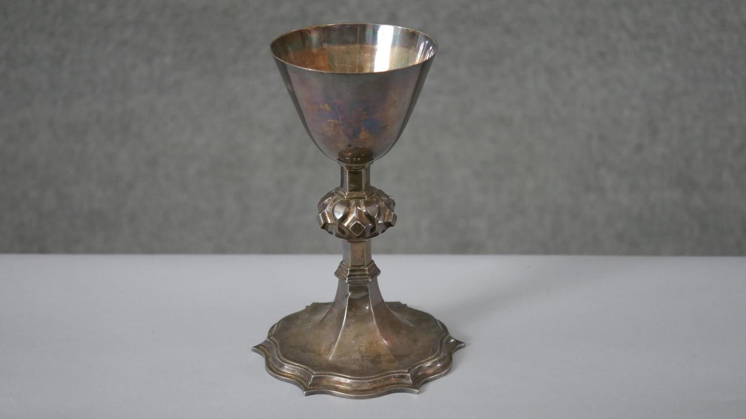 A Victorian silver communion cup. The lobed stem having raised bosses on a shaped plinth base. - Image 2 of 6