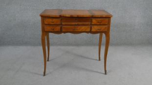 A late 19th century French Louis XV style kingwood and walnut crossbanded dressing table with fold