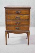 A late 19th century walnut music cabinet with hinged fall front sheet music drawers. H.78 W.50 D.