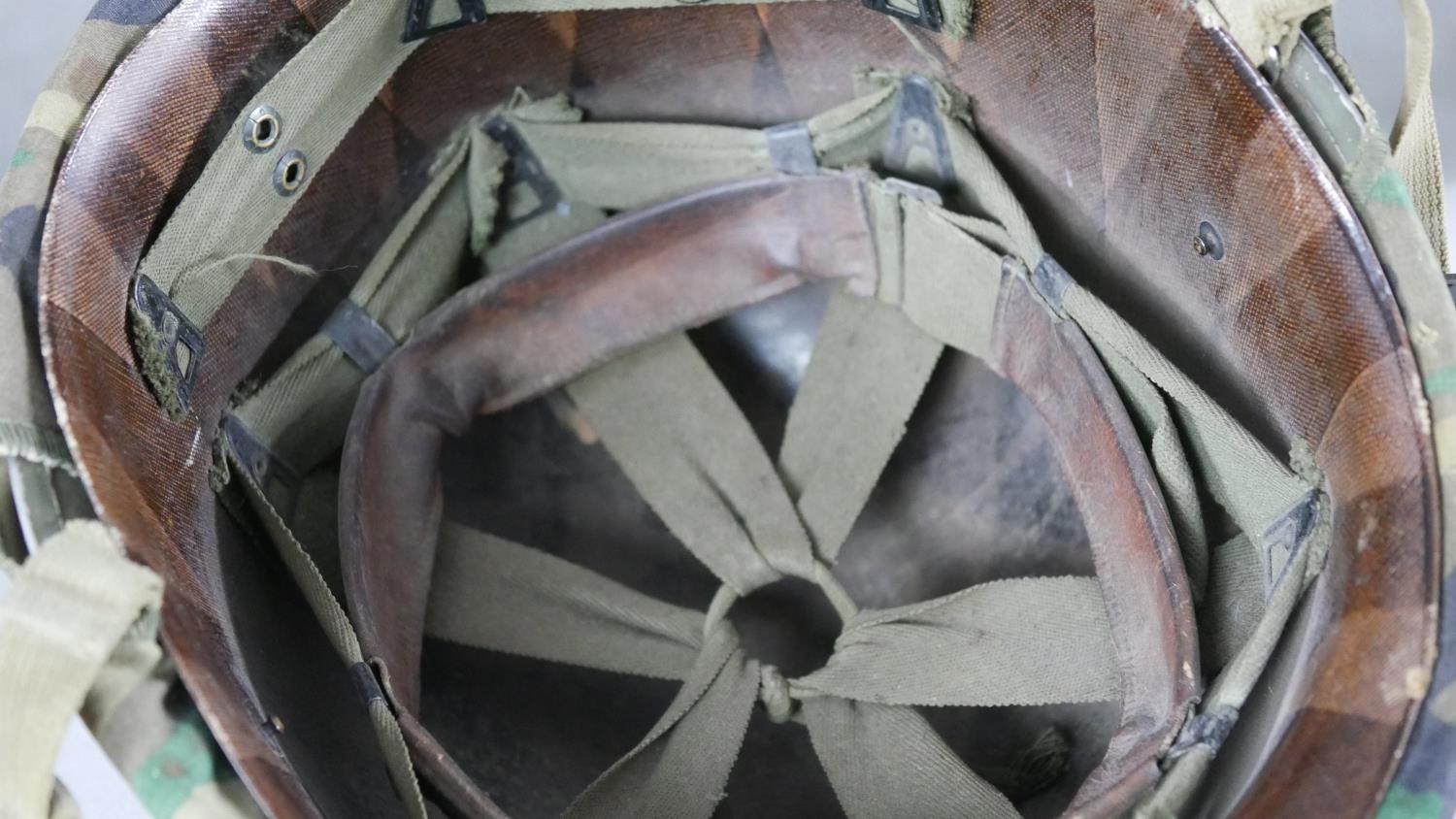 A WW2 US Schlueter helmet with camouflage canvas hood liner. H15 W.24 D.28cm - Image 3 of 5