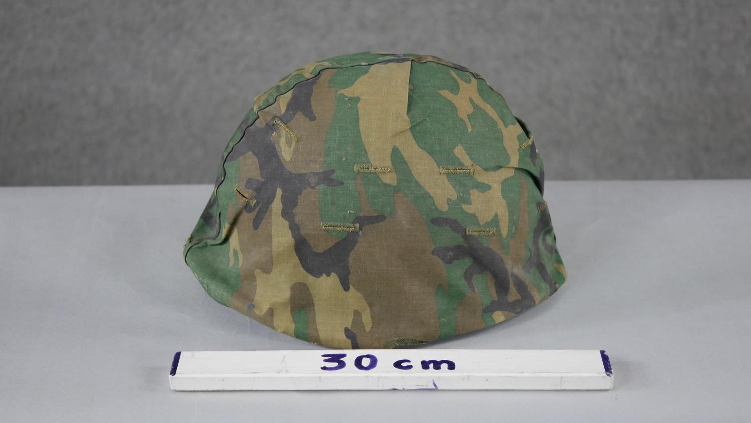 A WW2 US Schlueter helmet with camouflage canvas hood liner. H15 W.24 D.28cm - Image 5 of 5