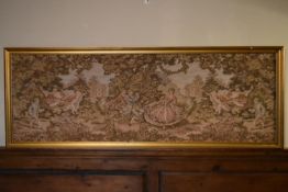A large gilt framed Aubusson style wall hanging of a garden dance scene. H.75 W.204cm