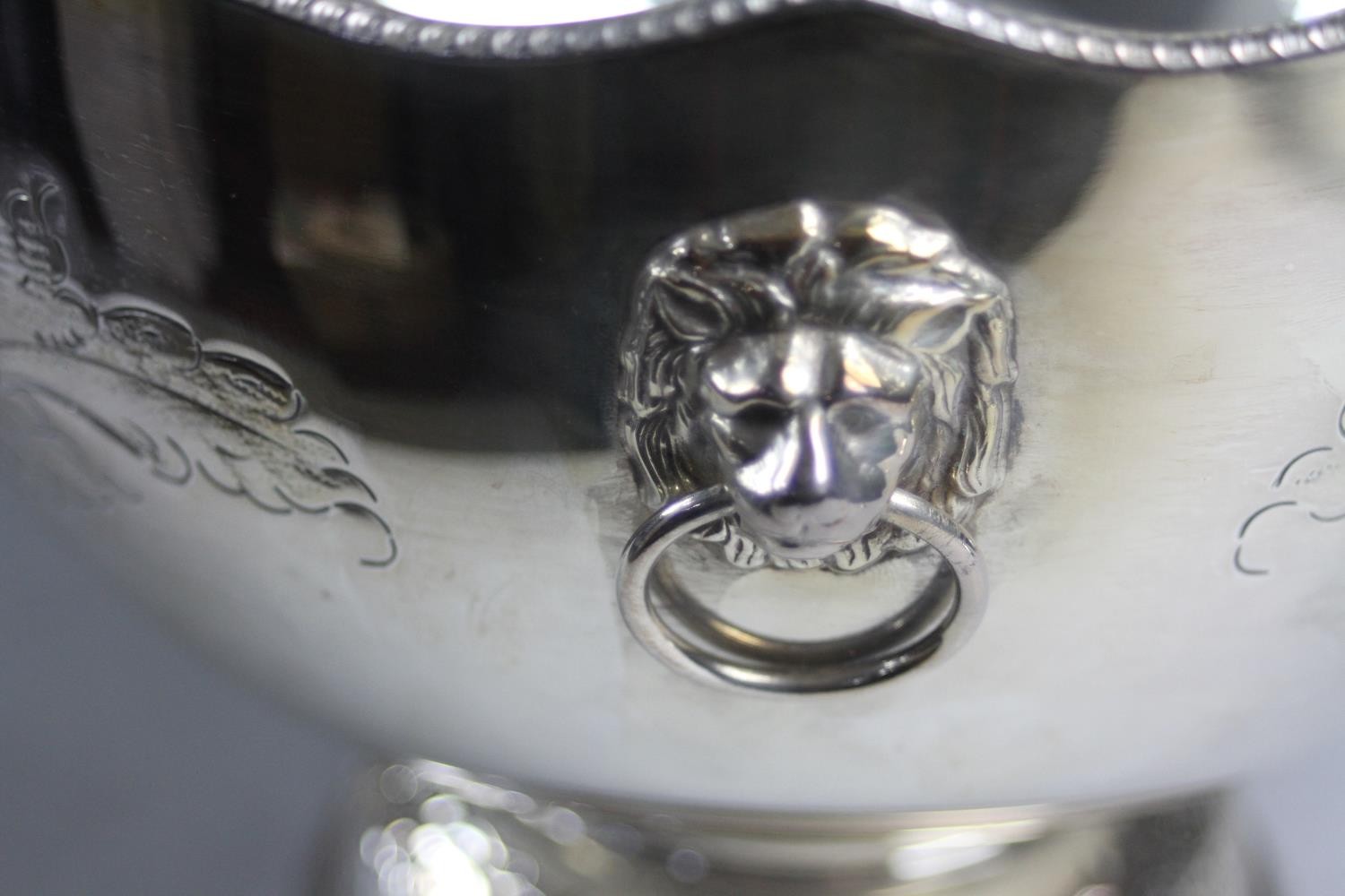 A hand chased floral design silver plate punch bowl and ladle. The pedestal bowl with twin lion head - Image 5 of 9