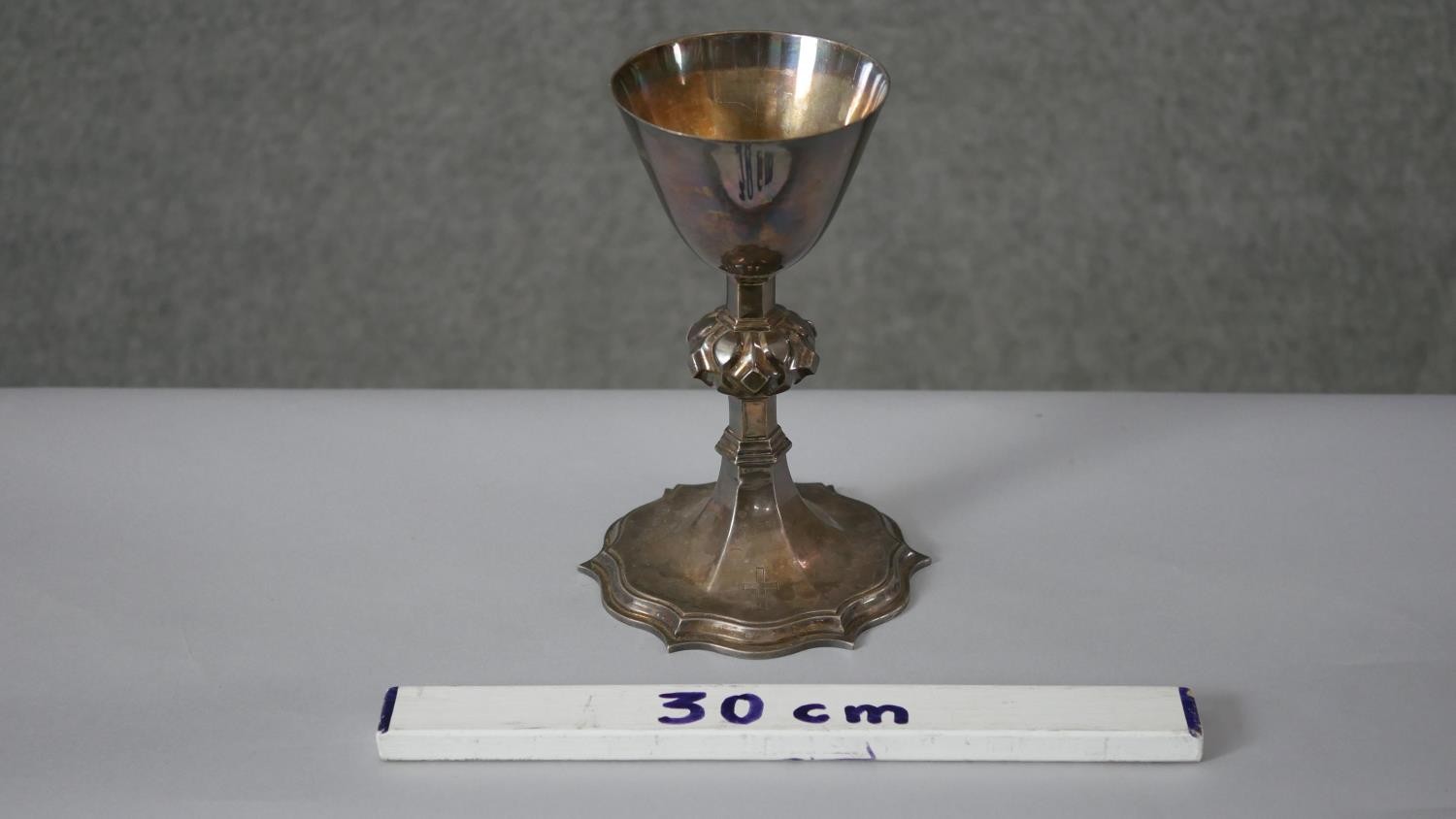 A Victorian silver communion cup. The lobed stem having raised bosses on a shaped plinth base. - Image 3 of 6