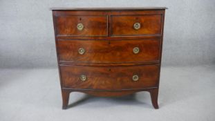 A Georgian mahogany bow fronted chest of drawers on swept bracket feet. H.90 W.93 D.50cm