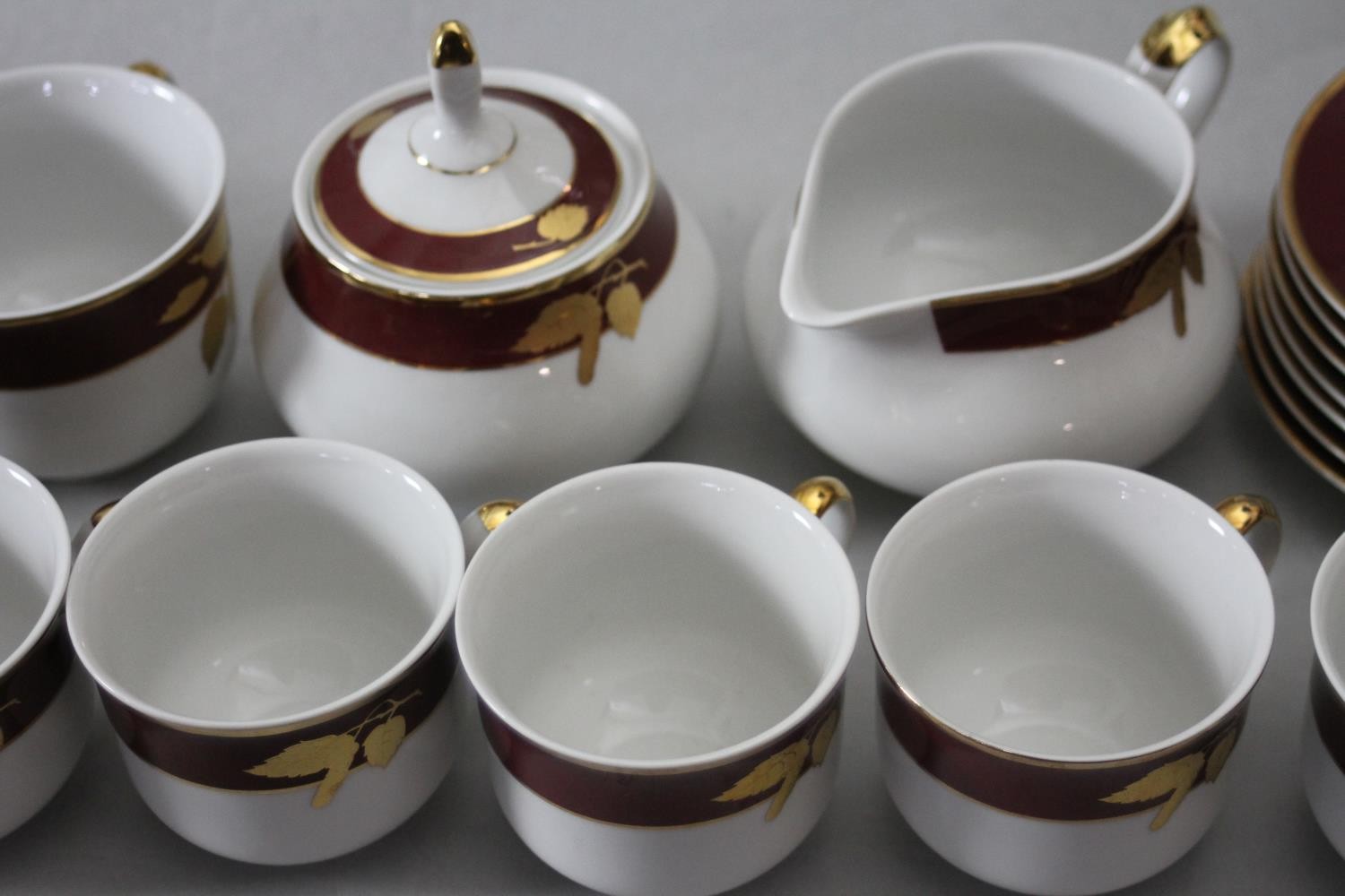 A Thun Czech porcelain twelve person part dinner set in maroon and gilt fruit design. Comprising - Image 13 of 15