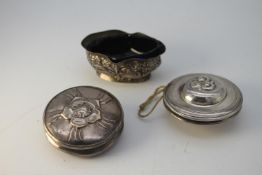 Two silver plated yo -yos, one with a floral design and the other a swirl design along with a silver