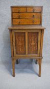 A late 19th century amboyna, walnut and ebony bijouterie cabinet fitted with drawers to the upper