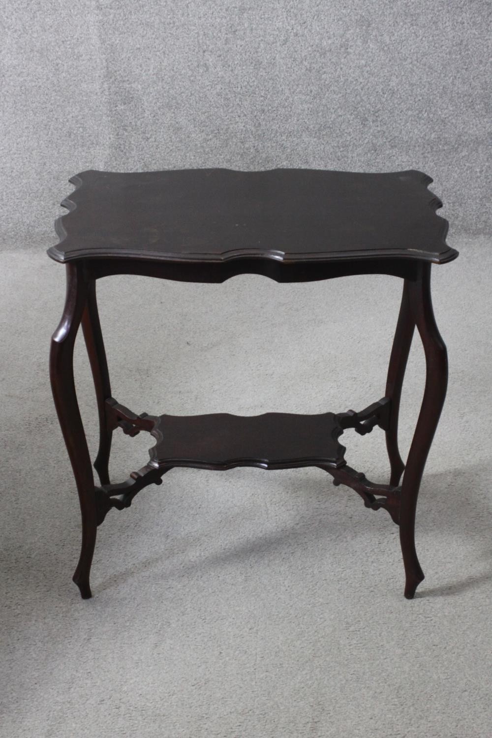A C.1900 shaped top occasional table on cabriole supports united by under tier. H.67 W.64 D.41 cm. - Image 3 of 5