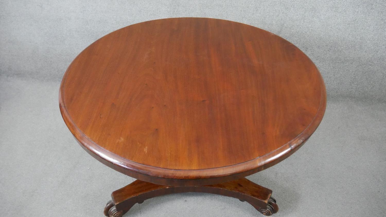 A 19th century mahogany tilt top dining table on faceted triform platform base. H.70 Diam.103cm - Image 3 of 5