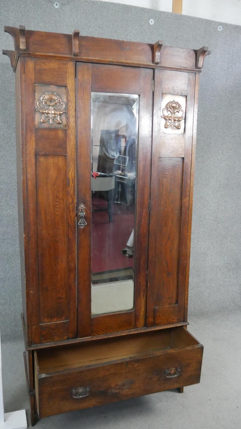 A late 19th century oak Arts and Crafts wardrobe with inset embossed copper panels. H.190 W.89 D. - Image 6 of 10