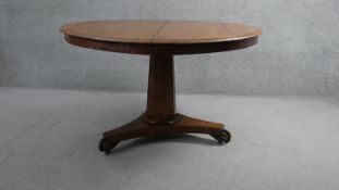 A 19th century mahogany tilt top dining table on triform pedestal base. H.70 Diam.110cm