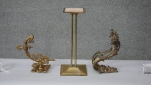Two Victorian gilt brass wall light brackets along with a brass column on square base. H.36 W.15cm