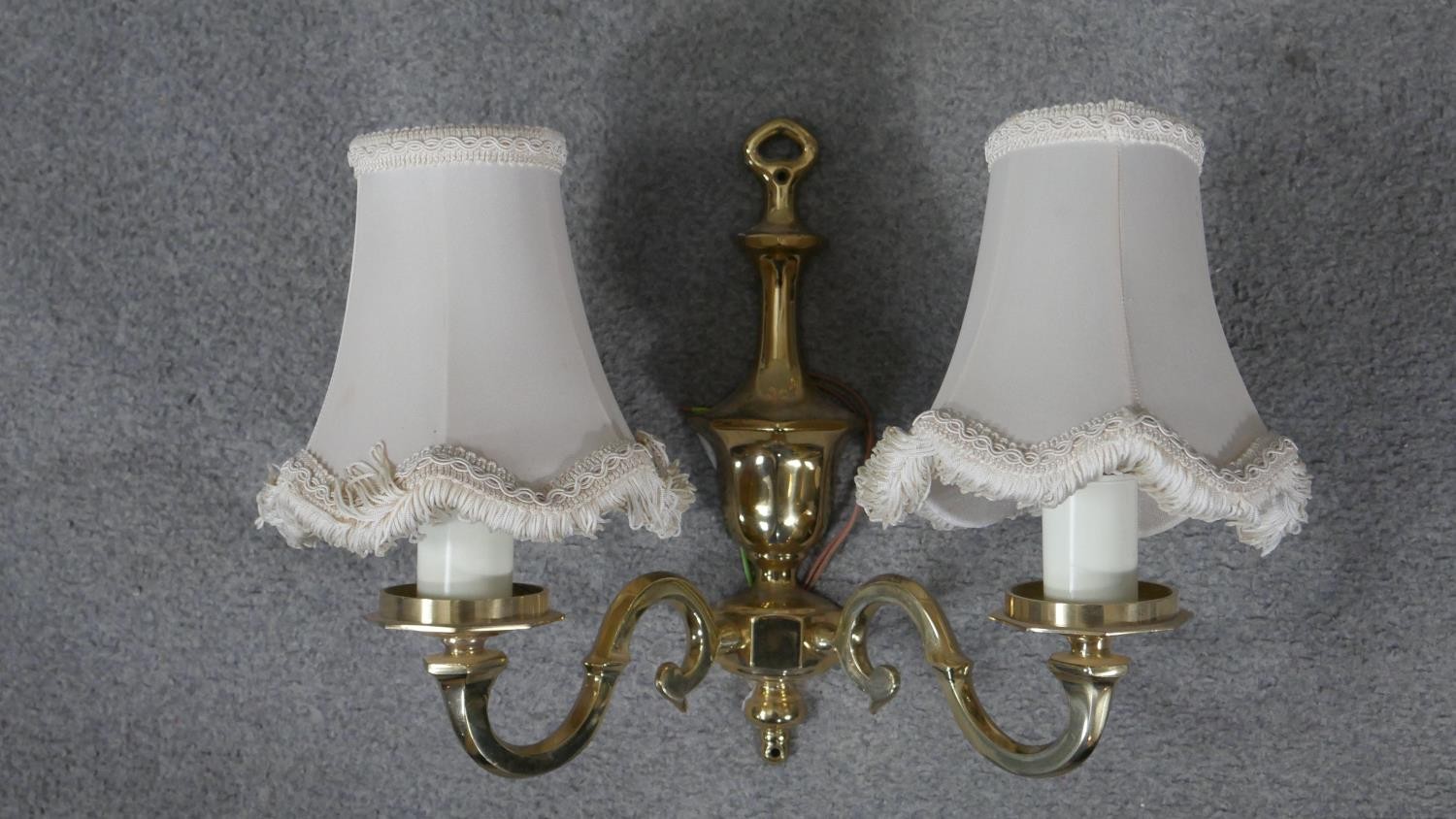 A set of four brass two branch scrolling design wall lights with cream silk shades and tassel - Image 2 of 4