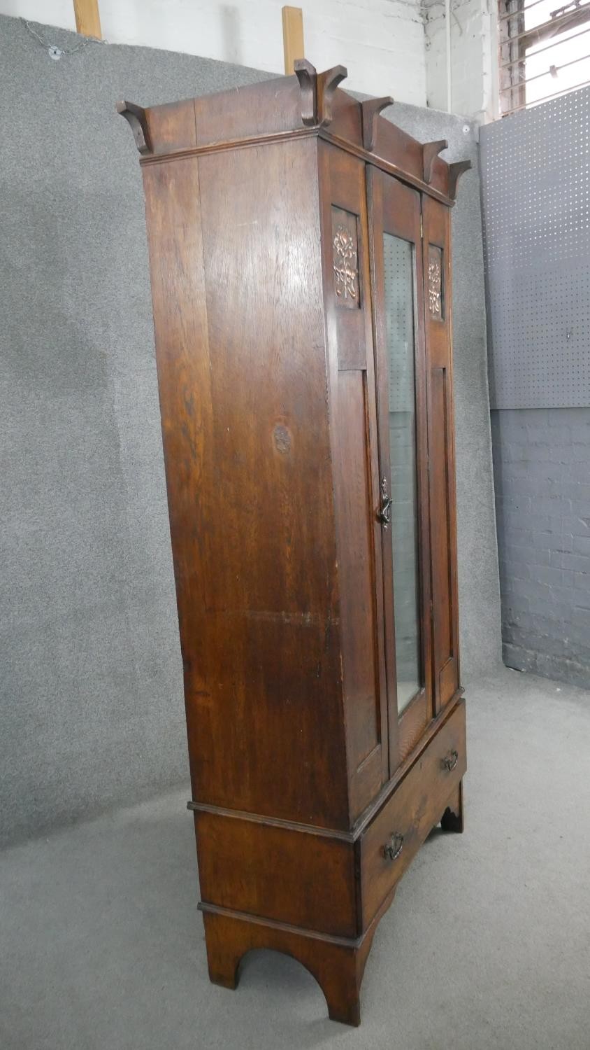 A late 19th century oak Arts and Crafts wardrobe with inset embossed copper panels. H.190 W.89 D. - Image 10 of 10