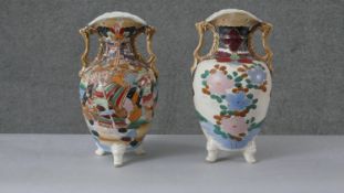 A pair of 19th century twin handled Japanese Satsuma ware vases. Decorated with warriors on one side