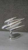 A vintage polished chrome model of a spacecraft on an oval base. H.24 W.26cm