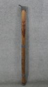 A large carved African rain stick with figural design. H.120 Diam.6cm