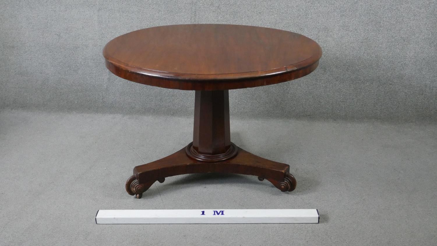 A 19th century mahogany tilt top dining table on faceted triform platform base. H.70 Diam.103cm - Image 2 of 5