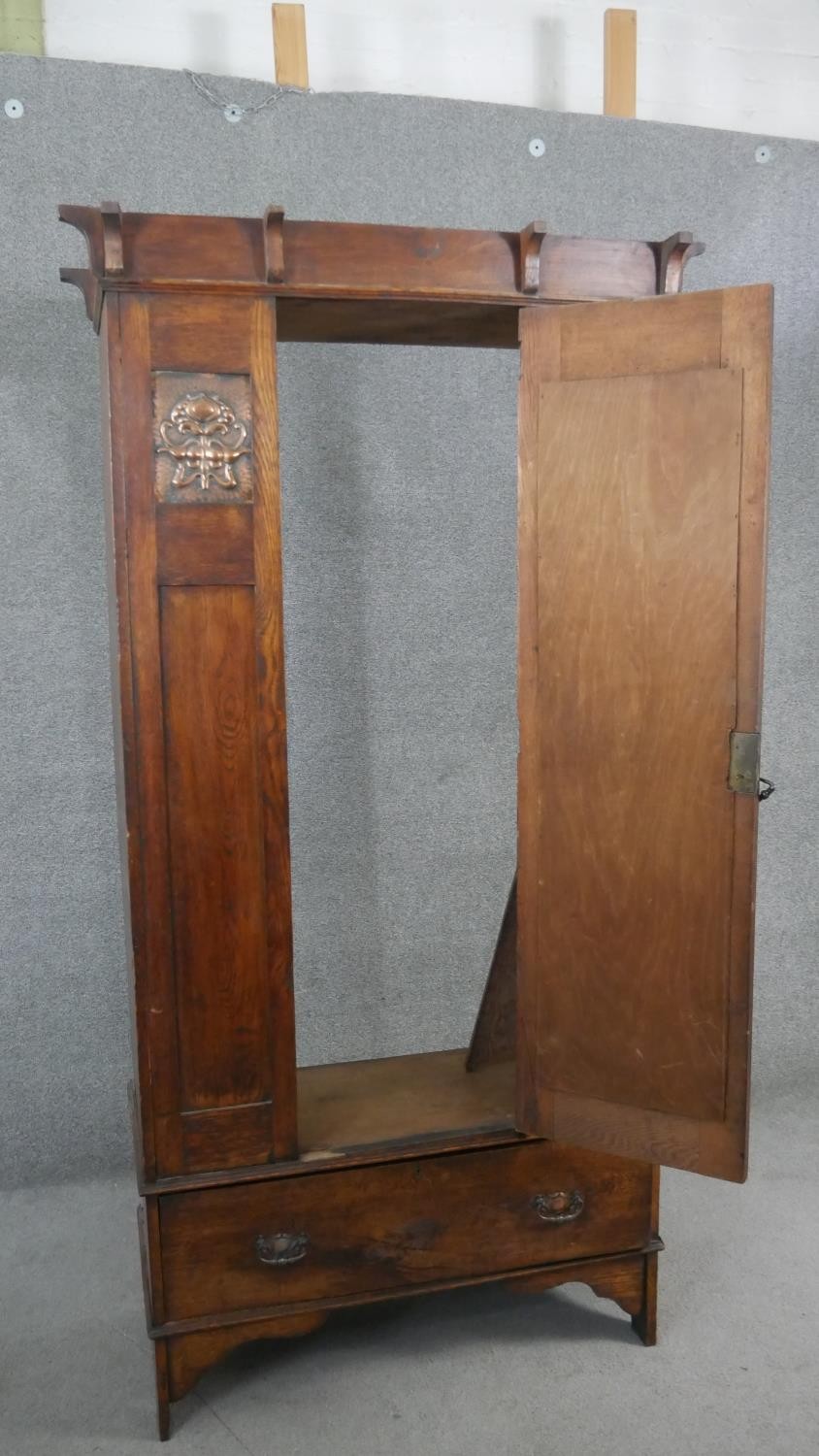 A late 19th century oak Arts and Crafts wardrobe with inset embossed copper panels. H.190 W.89 D. - Image 8 of 10