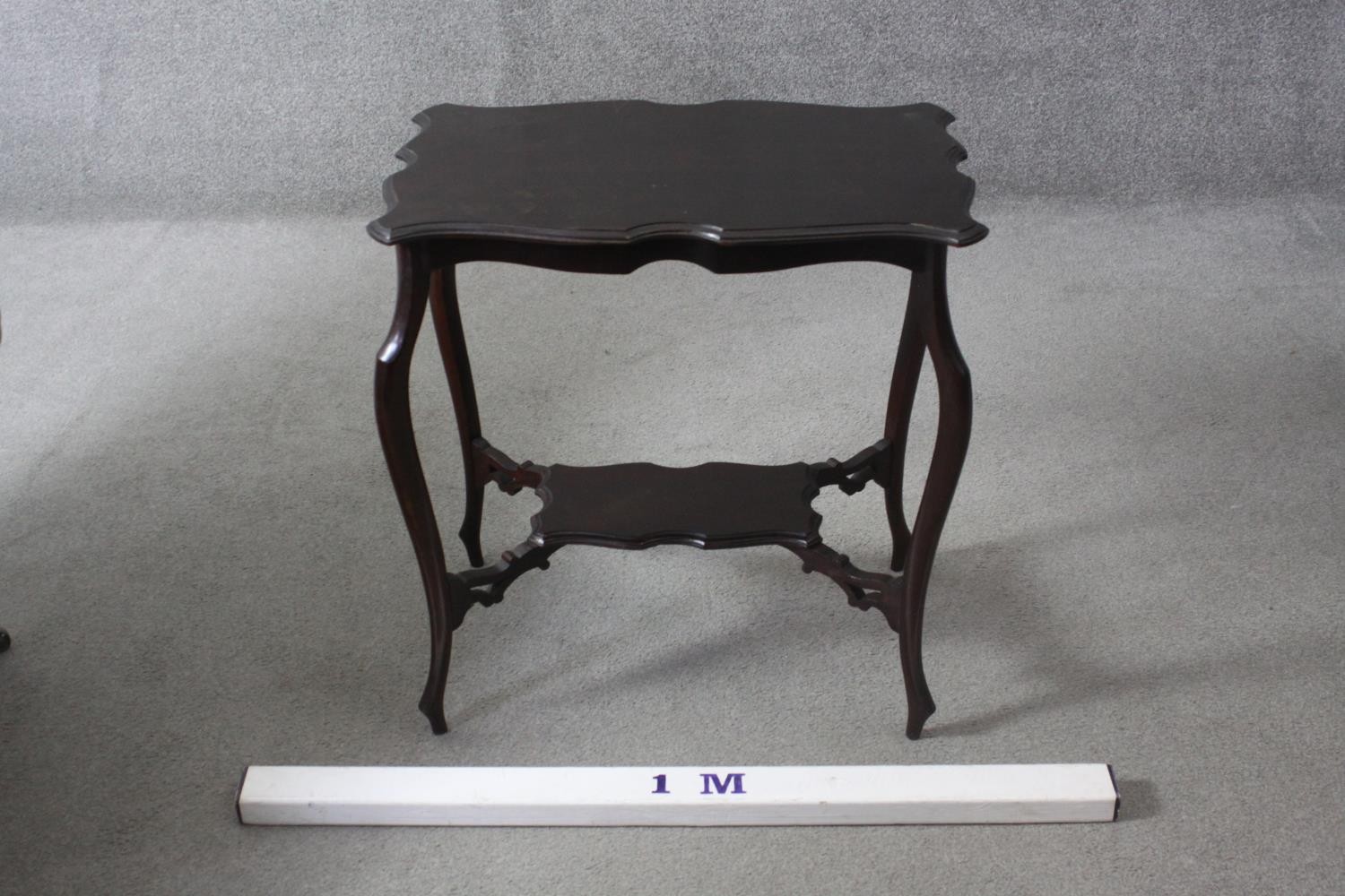 A C.1900 shaped top occasional table on cabriole supports united by under tier. H.67 W.64 D.41 cm. - Image 5 of 5
