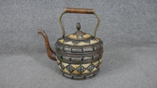A Moroccan copper, bone and white metal kettle with geometric design. (leaks) H.30 W.28cm
