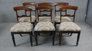 A set of six William IV mahogany bar back dining chairs with acanthus carved splats raised on carved