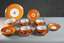 An Art Deco five person Gloria lustre porcelain orange fruit design part tea set (one cup