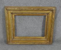 A 19th century giltwood picture frame with laurel leaf design. H.52 W.61cm