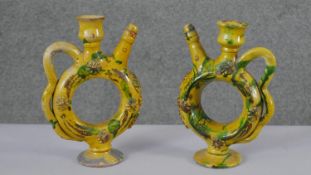 A pair of Turkish yellow glaze Canakkale ceramic olive oil ewers with green glaze decoration. H.24