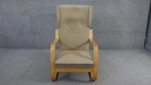 A mid century vintage Alvar Aalto Model 41 lounge chair on laminated birch cantilever frame. Stamped