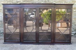 A Georgian style mahogany dwarf breakfront bookcase section with astragal glazed doors enclosing
