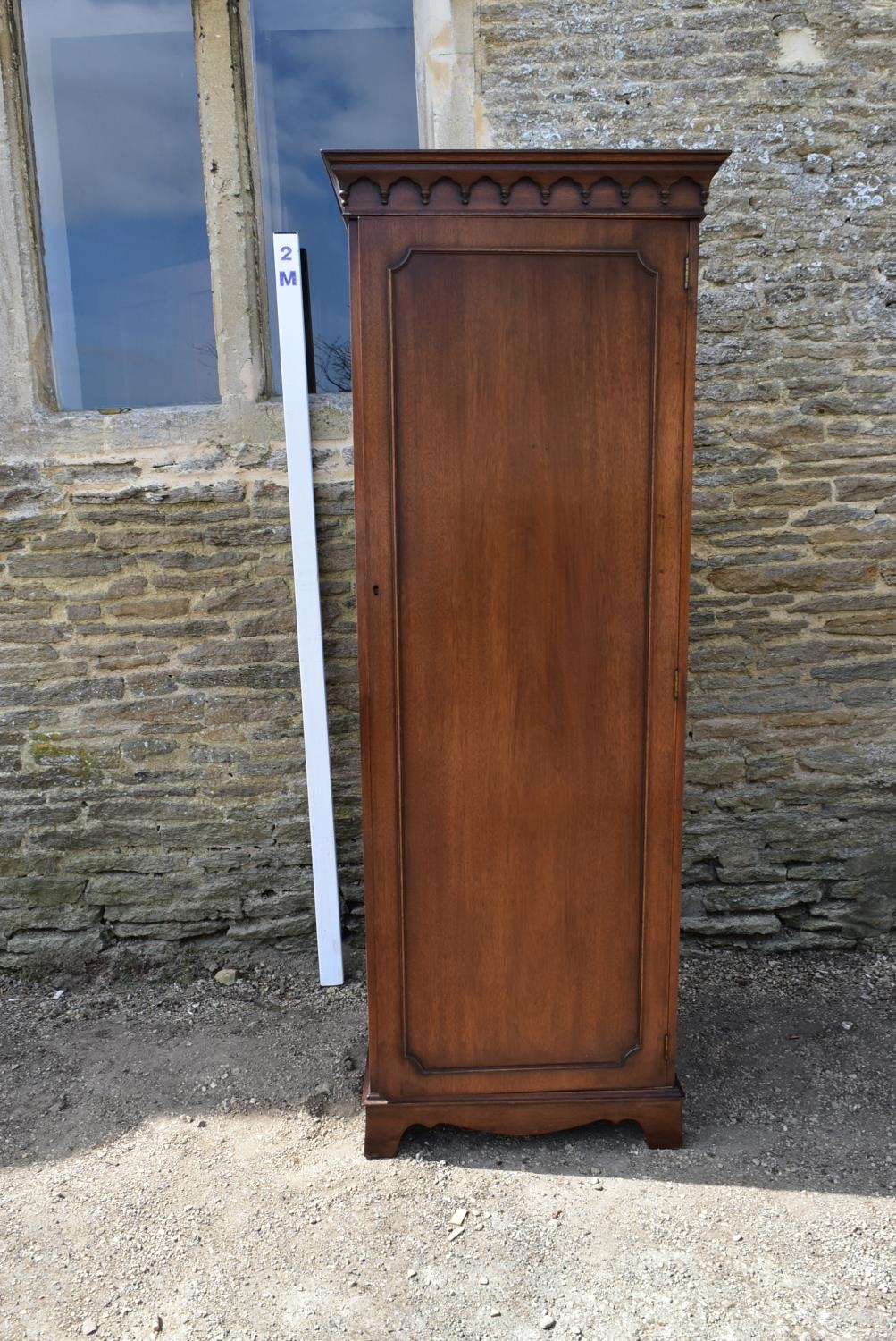 A Georgian style mahogany single wardrobe with panel door enclosing hanging section on shaped - Image 5 of 5