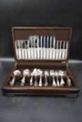 A 20th century cased 6 person Sheffield silver plated canteen set. Maker's marks to blades. H.11 W.