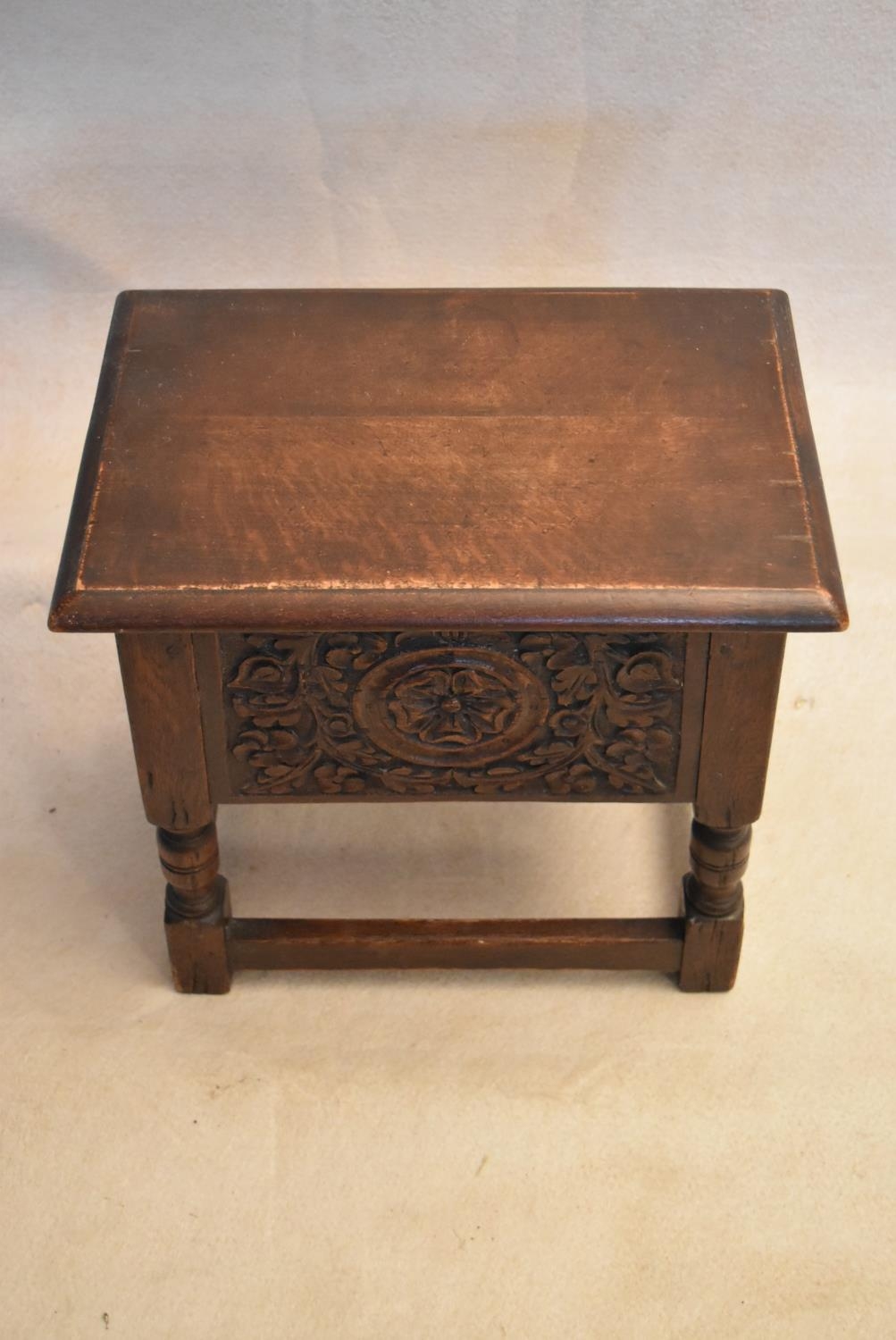 An 18th century country oak bible box stool with carved panel on turned tapering supports. H.47 W.44 - Image 2 of 7