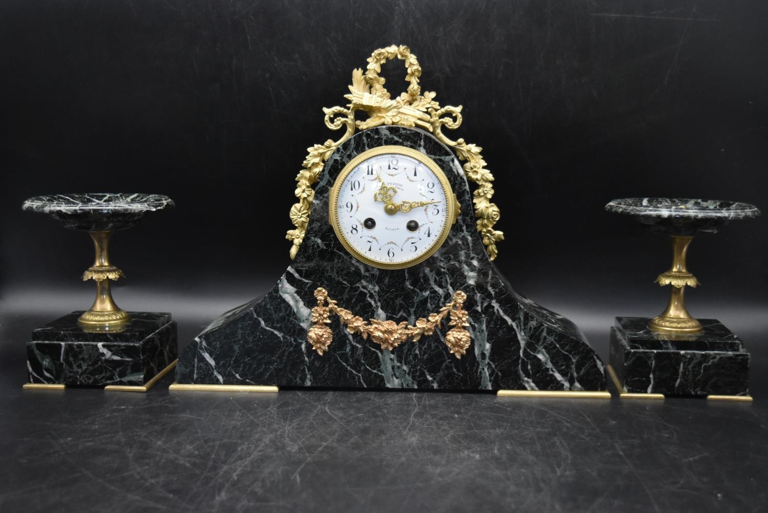 H. Perrin - A 19th century French garniture marble mantel clock and tazza form side pieces,