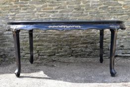 A mid century black lacquered and Chinoiserie decorated dining table with plate glass top. H.80 W.