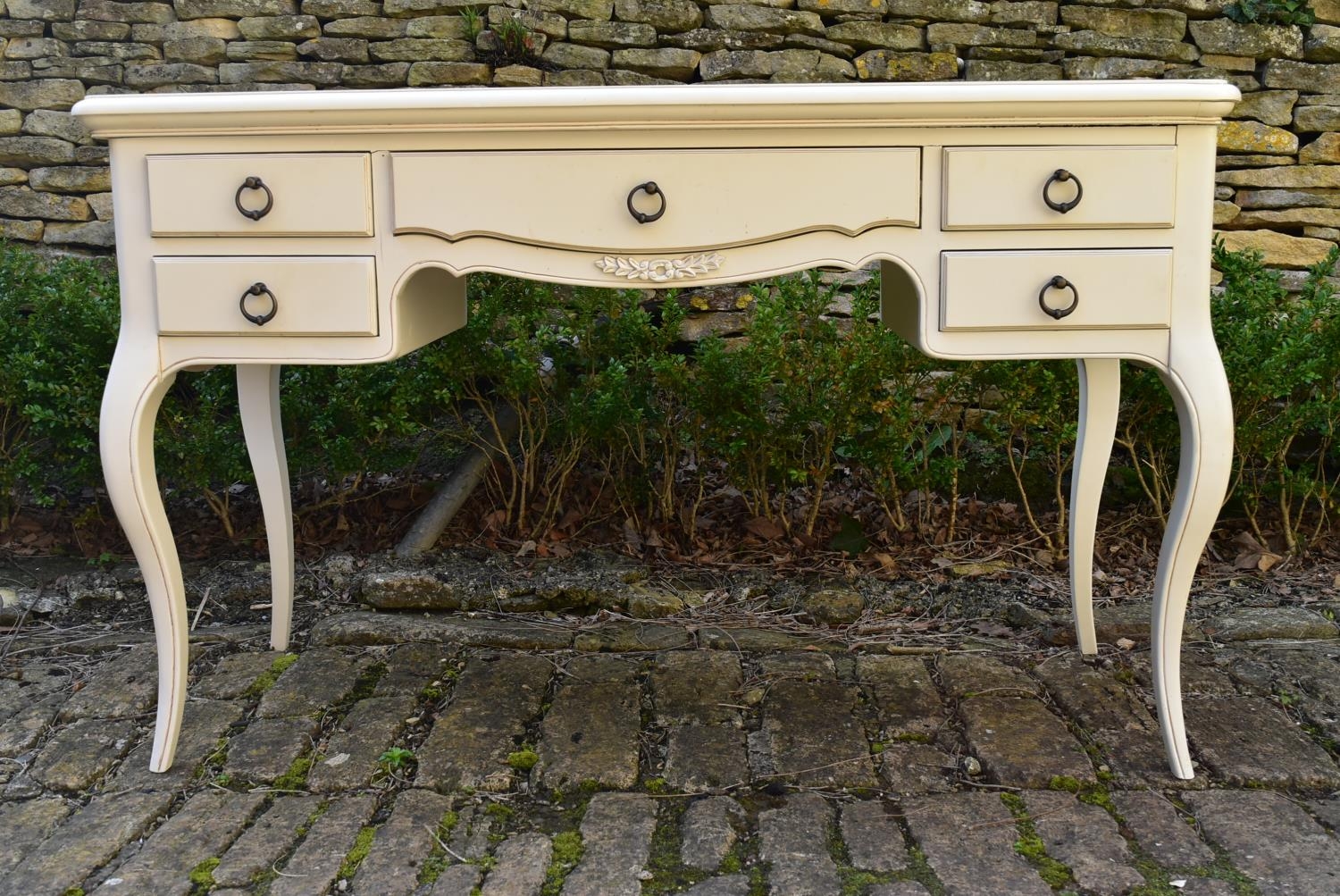 A lacquered Louis XV style writing table on cabriole supports. H.79 W.126 D.50cm