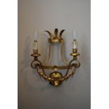 A 20th century gilt metal twin branch wall sconce with laurel leaf decoration. H.40 W.31cm
