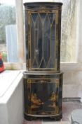 A Georgian style Chinoiserie decorated and lacquered corner cabinet with all over hand gilded