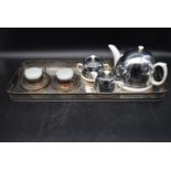 An Art Deco tea set for two with silver plated tray. To include a ceramic teapot, milk jug, sugar