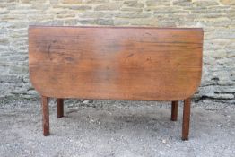 A Georgian mahogany drop flap dining table with gateleg action on square section supports. H.74 W.